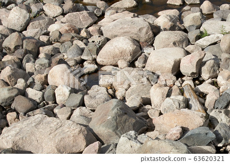 many different stones by the river 63620321