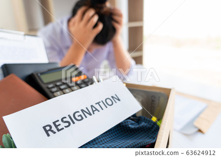Stress of business woman packing brown cardboard Stress of business woman packing brown cardboard 63624912