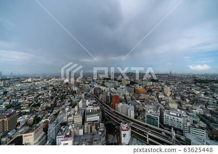 Tokyo cityscape in Japan Giant dark clouds spreading downtown (guerrilla heavy rain) 63625448