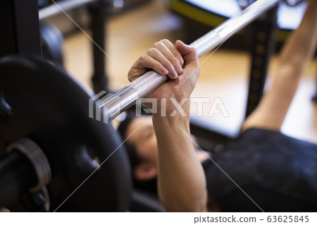 Hand with barbell Hand with barbell 63625845