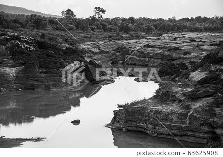 Large Sand stone canyon cliff shoreline of Mekong river Large Sand stone canyon cliff shoreline of Mekong river 63625908