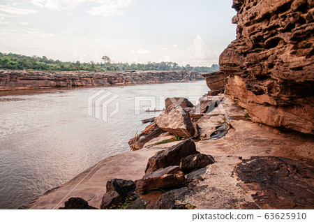 Large Sand stone canyon cliff shoreline of Mekong river Large Sand stone canyon cliff shoreline of Mekong river 63625910