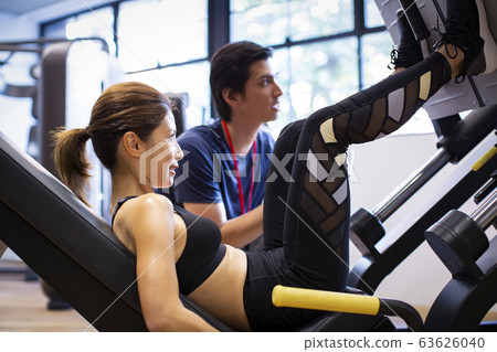 Training woman and trainer Training woman and trainer 63626040