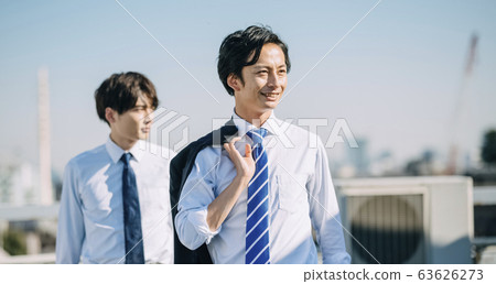 Businessman on the rooftop Businessman on the rooftop 63626273