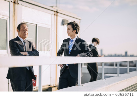 Businessman on the rooftop Businessman on the rooftop 63626711