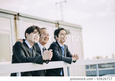 Businessman on the rooftop Businessman on the rooftop 63626717