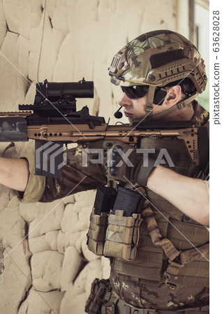Two men in military camouflage vegetato uniforms Two men in military camouflage vegetato uniforms 63628028