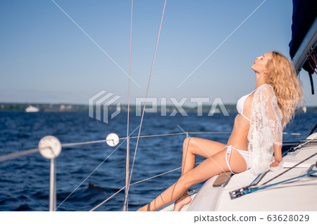 beautiful woman with a slim figure wearing white beautiful woman with a slim figure wearing white 63628029