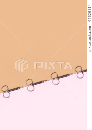 Manicure scissors on a two-color geometric background Manicure scissors on a two-color geometric background 63629114