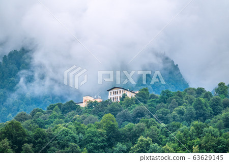 Hotel in the mountains among the green forest. 63629145