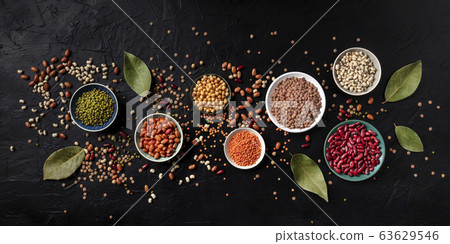 Legumes panorama, shot from the top on a black background. Lentils, soybeans, chickpeas, red kidney beans, a vatiety of pulses Legumes panorama, shot from the top on a black background. Lentils, soybeans, chickpeas, red kidney beans, a vatiety of pulses 63629546