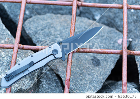 Pocket knife. Knife on the cage. Top. Pocket knife. Knife on the cage. Top. 63630173