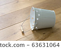 Tin bucket on the floor 63631064