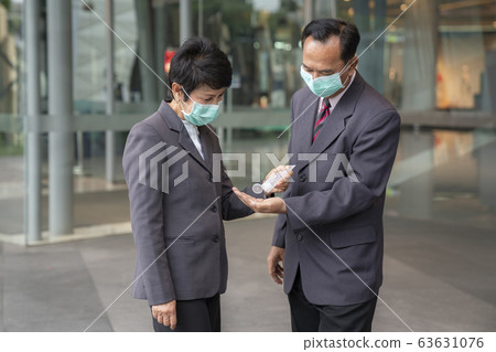 Old people in asia usd alcohol gel cleaning her 63631076