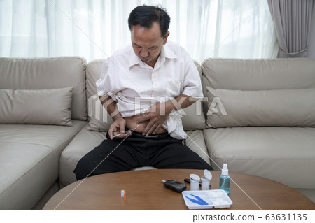 Asian old man test diabetes check and injec Asian old man test diabetes check and injec 63631135