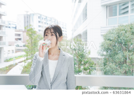Young business woman smoking electronic taco Young business woman smoking electronic taco 63631864