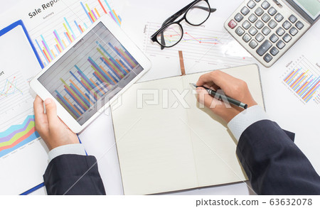 Male manager putting his ideas and writing 63632078