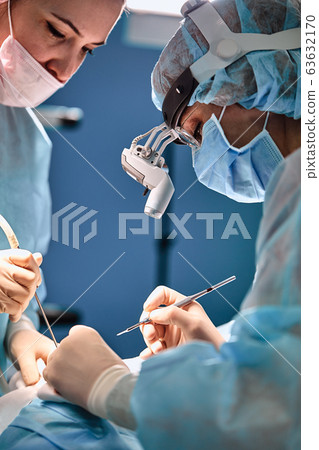 A shot of an emergency and a serious accident in the operating room, a team of surgeons makes an emergency operation to people in an accident. Saving lives, modern medetsina. 63632170