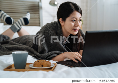 freelancer working on pc in morning meal time. freelancer working on pc in morning meal time. 63632260