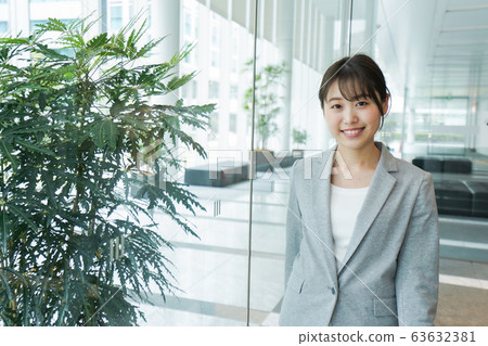 Young business woman walking in office 63632381