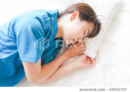 Young nurse taking a nap 63632787
