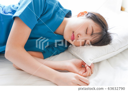 Young nurse taking a nap 63632790