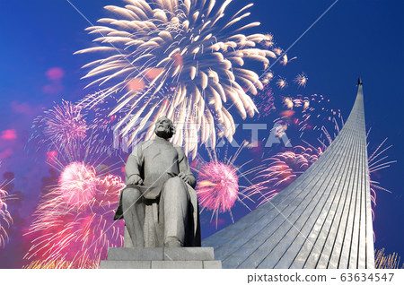 A statue of Konstantin Tsiolkovsky and Conquerors of Space Monument and fireworks, Moscow, Russia A statue of Konstantin Tsiolkovsky and Conquerors of Space Monument and fireworks, Moscow, Russia 63634547