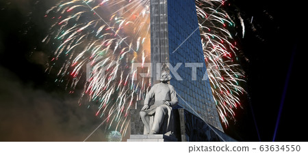 A statue of Konstantin Tsiolkovsky and Conquerors of Space Monument and fireworks, Moscow, Russia A statue of Konstantin Tsiolkovsky and Conquerors of Space Monument and fireworks, Moscow, Russia 63634550