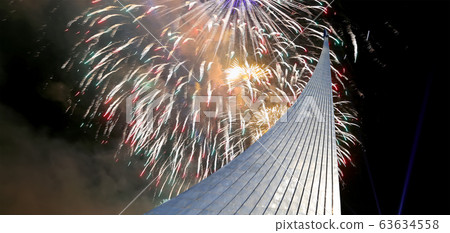 Conquerors of Space Monument in the park outdoors of Cosmonautics museum and fireworks, near VDNK exhibition center, Moscow, Russia Conquerors of Space Monument in the park outdoors of Cosmonautics museum and fireworks, near VDNK exhibition center, Moscow, Russia 63634558