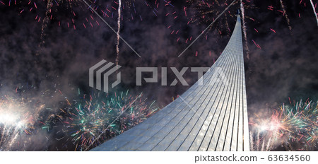 Conquerors of Space Monument in the park outdoors of Cosmonautics museum and fireworks, near VDNK exhibition center, Moscow, Russia Conquerors of Space Monument in the park outdoors of Cosmonautics museum and fireworks, near VDNK exhibition center, Moscow, Russia 63634560