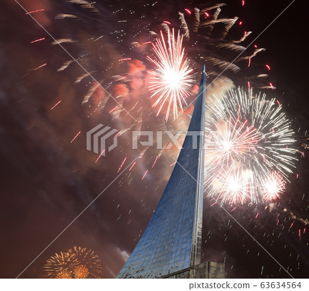 Conquerors of Space Monument in the park outdoors of Cosmonautics museum and fireworks, near VDNK exhibition center, Moscow, Russia Conquerors of Space Monument in the park outdoors of Cosmonautics museum and fireworks, near VDNK exhibition center, Moscow, Russia 63634564