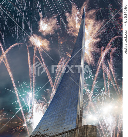 Conquerors of Space Monument in the park outdoors of Cosmonautics museum and fireworks, near VDNK exhibition center, Moscow, Russia Conquerors of Space Monument in the park outdoors of Cosmonautics museum and fireworks, near VDNK exhibition center, Moscow, Russia 63634566