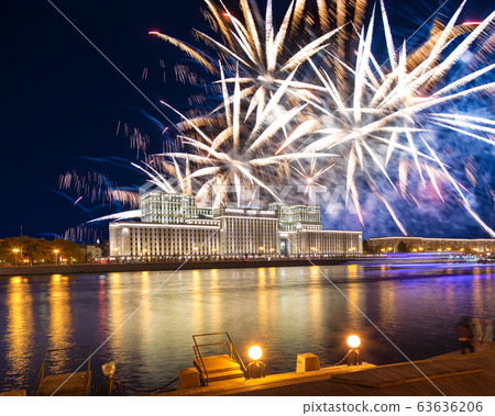 Main Building of the Ministry of Defence of the Russian Federation-- is the governing body of the Russian Armed Forces and celebratory colorful fireworks exploding in the skies. Moscow, Russia 63636206