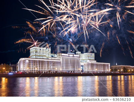 Main Building of the Ministry of Defence of the Russian Federation-- is the governing body of the Russian Armed Forces and celebratory colorful fireworks exploding in the skies. Moscow, Russia 63636210