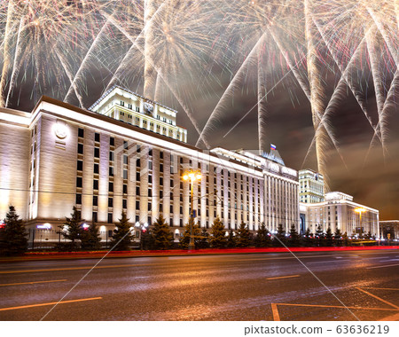 Main Building of the Ministry of Defence of the Russian Federation-- is the governing body of the Russian Armed Forces and celebratory colorful fireworks exploding in the skies. Moscow, Russia 63636219