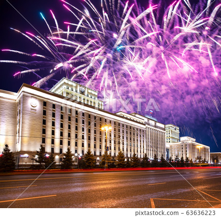 Main Building of the Ministry of Defence of the Russian Federation-- is the governing body of the Russian Armed Forces and celebratory colorful fireworks exploding in the skies. Moscow, Russia 63636223