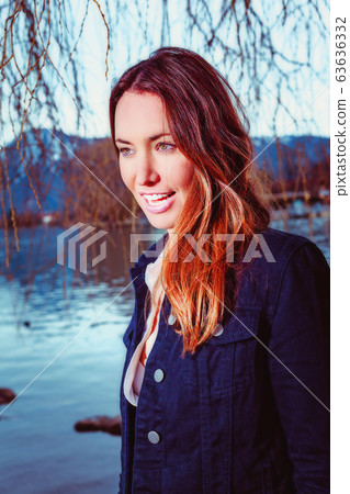 Portrait of a young brunette woman at the  63636332