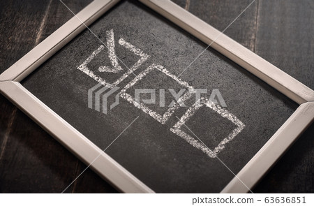 Blackboard with check boxes on chalk board. Hand 63636851