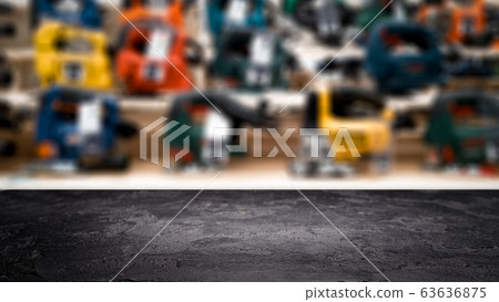 Black stone surface on blurry background in hardware store. Black stone surface on blurry background in hardware store. 63636875