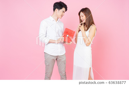 couple with pink background 63638877