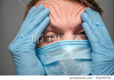 Coronavirus disease, male face. COVID-19. Critical time: pandemic. Social distancing background. nCov panic. Accurate health information. Health Alert background. Vital information about COVID-19. 63640792