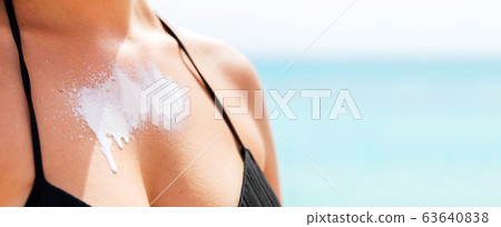 Beautiful young woman is enjoying sunshine at the 63640838