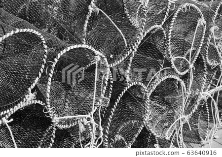 Traps for crabs stacked in fishing port 63640916