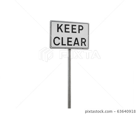 eep clear. Caution sign on a metal pole isolated 63640918