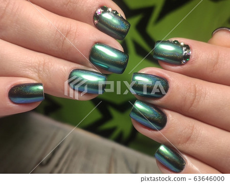 fashion manicure of nails on a beautiful 63646000