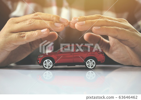 Male hands and car as protection of car insurance Male hands and car as protection of car insurance 63646462