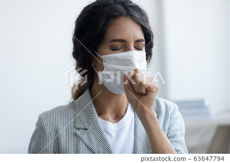 Sick woman in medical mask infected with corona virus 63647794
