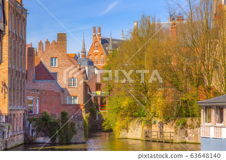 Scenic cityscape with canal in Bruges, Belgium Scenic cityscape with canal in Bruges, Belgium 63648140