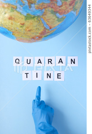 The word quarantine written on a blue background 63649344