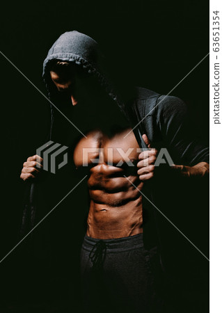 Strong Athletic Man Fitness showing abs 63651354